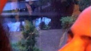 Wife sucks cock at window for neighbors to see - porn video